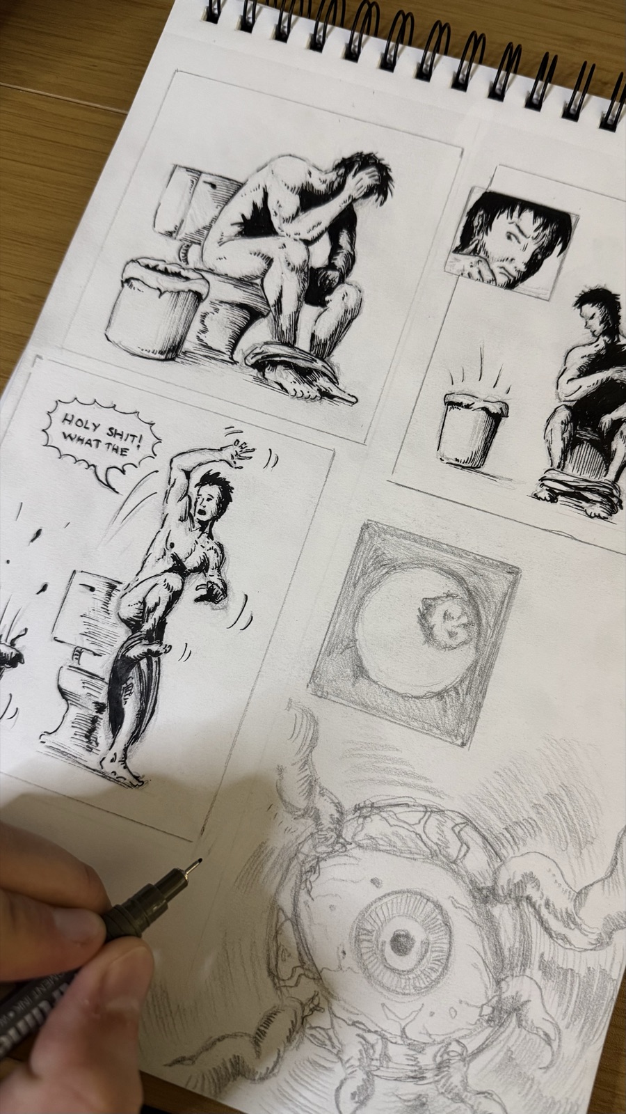 A comic page being inked by hand over the pencils